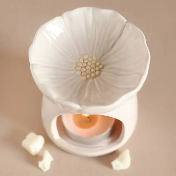 Luxury white ceramic essential oil diffuser and wax melt burner with detailed flower petal bowl, textured center, and artistic arch design for home fragrance