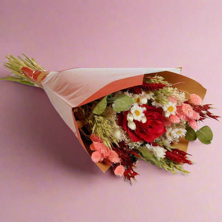 Valentine's Bouquet of Flowers featuring roses white daisies, pink pampas grass, baby's breath, mixed dried flowers and foliage